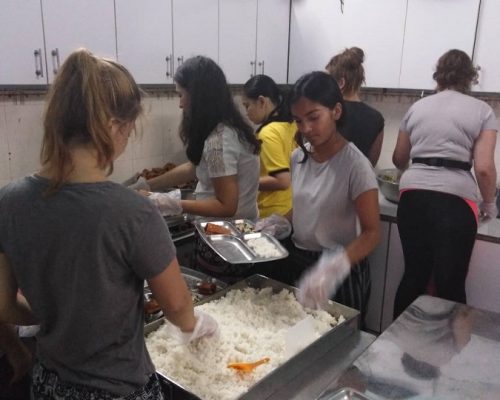 Preparing food IVI volunteers