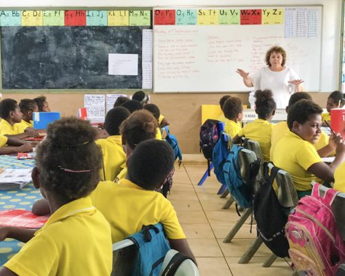 teacher at front of class