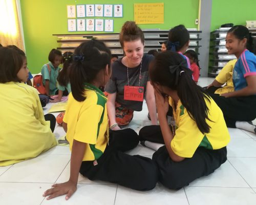 sitting on the floor teaching in groups