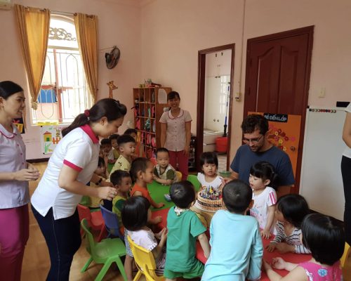 Serving a cake to the kids-Ho Chi Minh