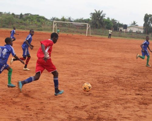 teaching children on football skills