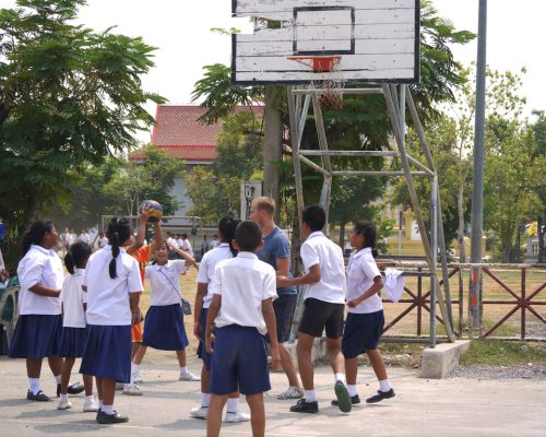 Student playing basketball