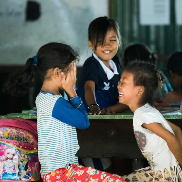 Students laughing on their desk-2