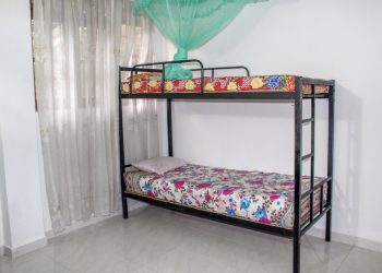 a bed with a mosquito net (Kandy)