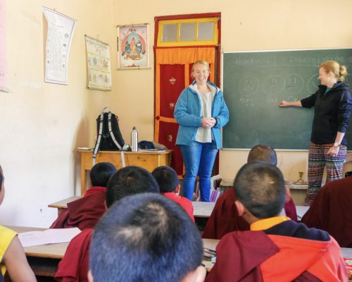 monks sitting at desks