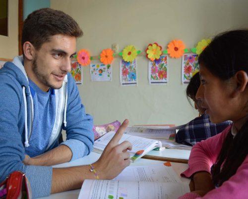 male volunteer helping a student-2