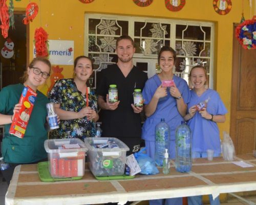 group holding medical supplies