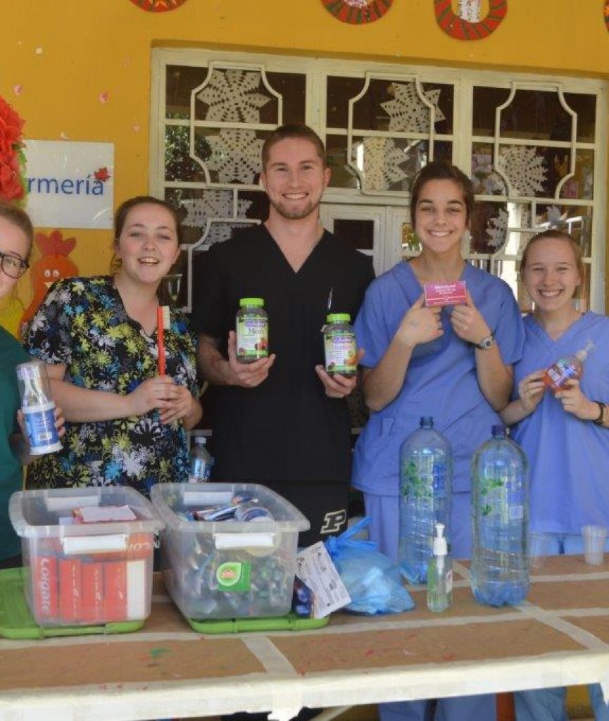 group holding medical supplies