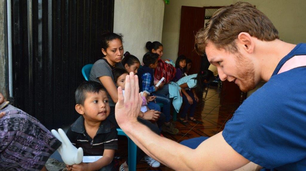 doctor high fiving a child