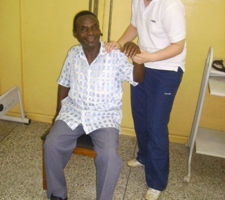 treating a local Ghanaian man in physio