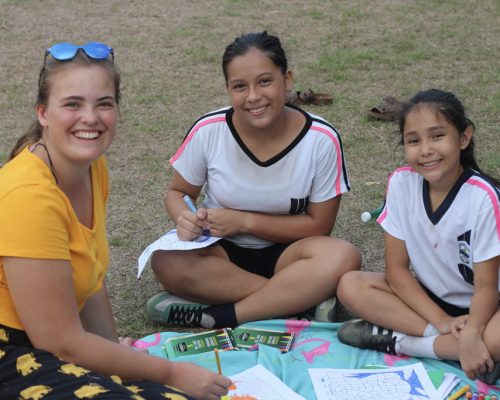 sitting on field to teach