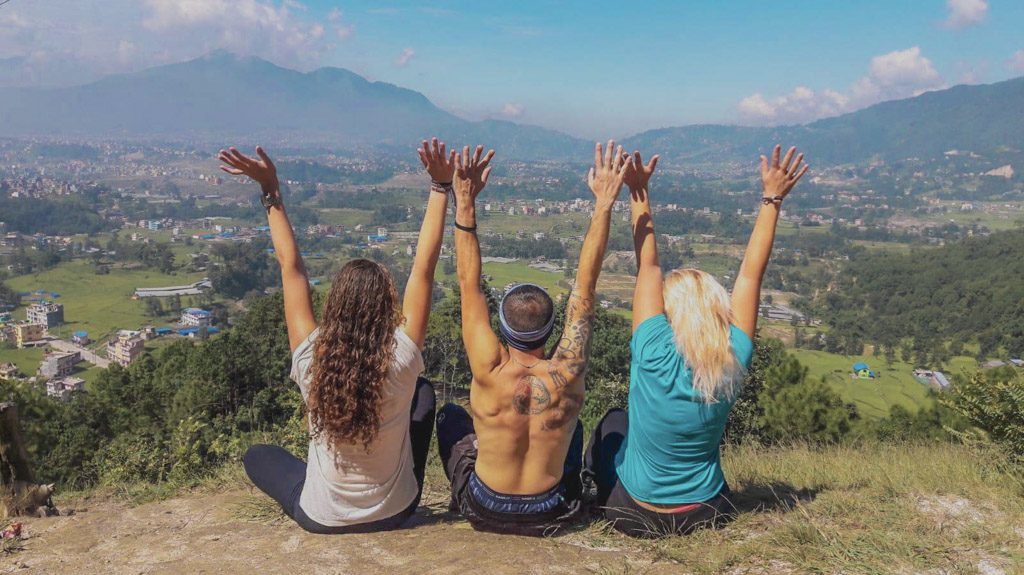 sitting on top of a hill overlooking countryside