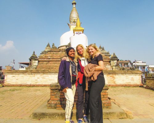 standing by temple in Nepal