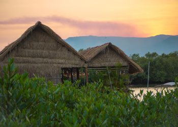 straw huts and beautiful sunset