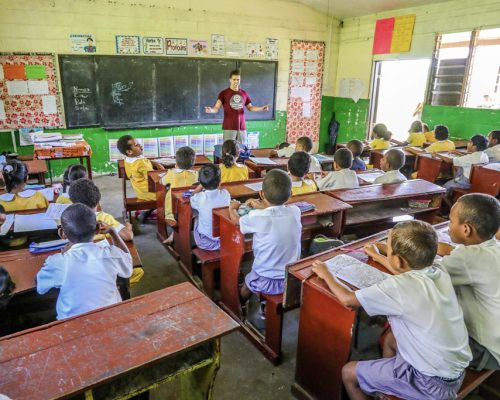 students being taught in classroom