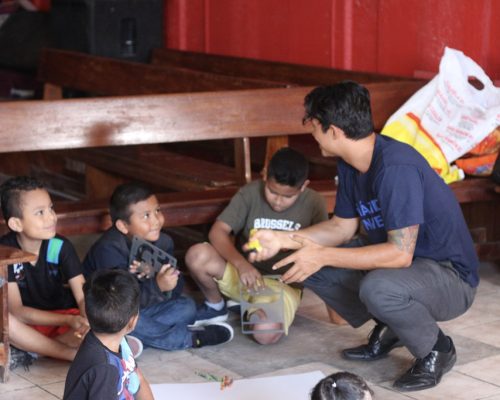 volunteer talking with students