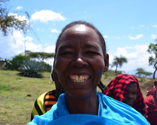 local Tanzanian woman smiling at camera